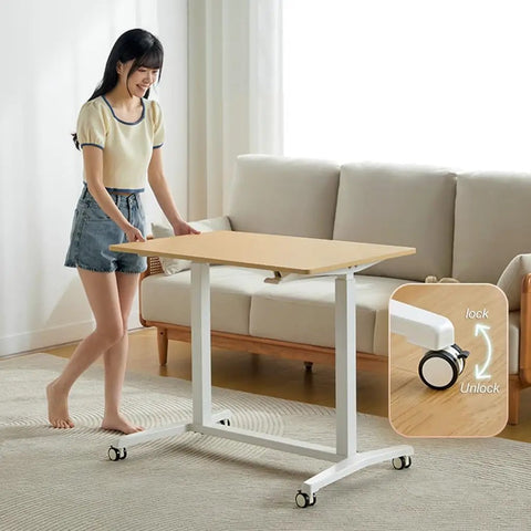 Electric Sit Stand Desk Offering Smooth Height Adjustment, Mobile Rolling Computer Workstation For Home Office with caster mechanism.