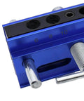 Close-up of adjustable doweling jig kit with six guide bushings showing measurement scale for woodworking.