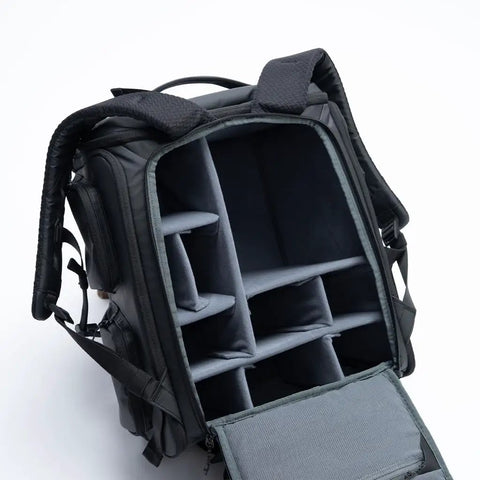 Open Cube Camera Backpack showing padded camera compartments for filmmakers and photographers, weatherproof design.