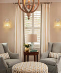 White Wall Sconces Set Of 2 With Adjustable 240 Degree Swing Arm Dope Boho Rattan Cage Lamps in a living room setting