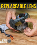 Hands holding clear lens safety goggles with anti fog scratch resistant eye protection PPE UV shield and adjustable vents