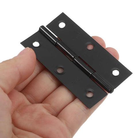 A person holding black stainless steel cabinet door hinge with screws for easy opening and closing foldable butt hinges for wooden box doors.