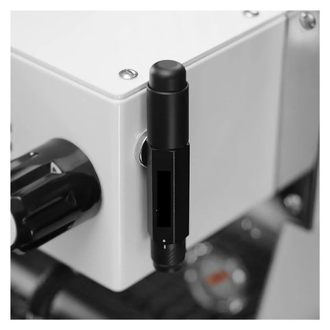 Close-up of the Professional Espresso Coffee Ground Distributor With 16 Stainless Steel Needles Magnetic Telescopic Stirrer attached to a coffee machine.
