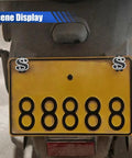 Fresh Ride Upgrades Four Piece Set Of Dope Black Us Dollar Car License Plate Screws on a motorcycle license plate with yellow background.