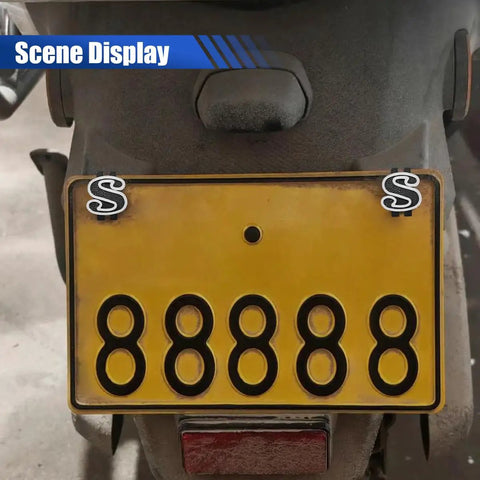 Fresh Ride Upgrades Four Piece Set Of Dope Black Us Dollar Car License Plate Screws on a motorcycle license plate with yellow background.
