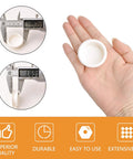Hand holding 4 Pack Plastic Round Sliding Door Finger Pulls For Closets And Cabinets, with measurement tool, bright white finish
