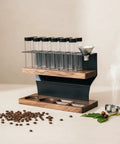 Two Tier Wooden Coffee Bean Storage Rack With Airtight Glass Jars Featuring Black Vent Lids Countertop Flex Freshness Sealer Brew Day Ready Kitchen Organization Set Keep Beans Crisp on display with coffee beans.