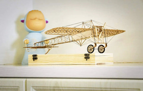 DIY Balsa Wood Airplane Kit For Adults Dope Laser Cut Bleriot Style Model Plane on display shelf with wooden base