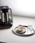 Turkish Coffee Maker Electric With Open Form Design For Watching Foam Rise And Savoring Aroma SandBrew Technology displayed on countertop
