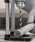 No Sweat Adjustable Woodworking Drill Guide With Precision Drilling Template in use on wood with a drill bit.