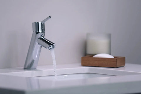 Talis S Modern Timeless Easy Clean 7-Inch Tall Bathroom Sink Faucet 1-Handle Chrome Finish flowing water in modern bathroom