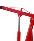 Close-up of the hydraulic arm of the Savage Folding Hydraulic Engine Hoist Stand, 2 Ton Cherry Picker with sturdy red steel.