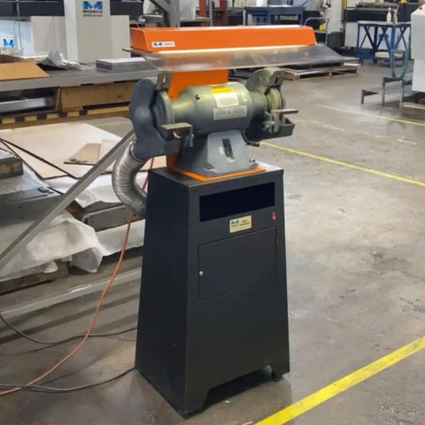 Kickass Dust Collection System For Eight Inch Angle Grinders featuring a black base and gray motor, designed for capturing dust effectively.