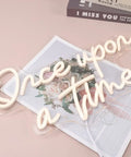 Once Upon A Time Neon LED Light Sign Warm White 15.8 Inch By 8.9 Inch USB Powered 5V Wall Or Table Decor on pink surface