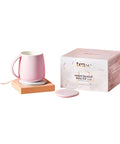 Self Heating Mug With Phone Controlled Heat Settings And Wireless Charging Stand To Keep Your Morning Brew Piping Hot All Day Long Sip At Your Pace While This Rechargeable Tech Build Keeps Every Drop Cozy And Fresh, pink ceramic mug with wireless charger and box.