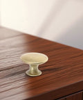 6pc Vintage Round Cabinet Knobs Gold Antique Finish With DIY Friendly Easy Install Drawer Pulls For Cabinets on wooden surface