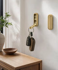 Sleek Black Folding Wall Hooks Four Pack With Swivel Hinge Design Perfect For Tight Spaces And Narrow Hallways No Hassle Kickback Mount holding keys.