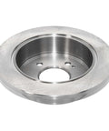 Rear Solid Disc Brake Rotor With Beefy Forged Flange For Precise Fit And ABS Signaling, close-up view of metal rotor.
