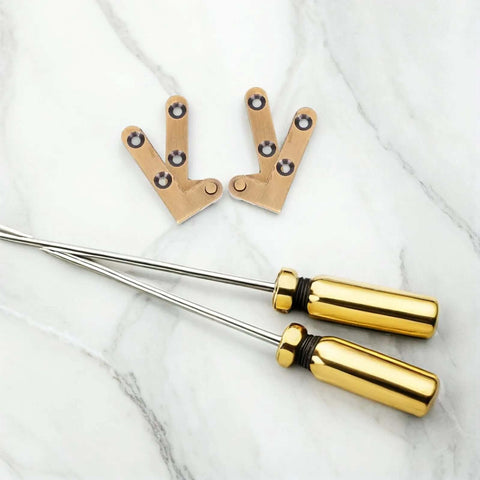 Heavy Duty Bronze Pivot Door Hinges Set With Hidden Self Closing Hardware posed with tools on marble surface.