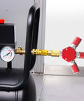 Red Aluminum 3 Way One Quarter Inch NPT Air Manifold With Hex Style Includes Three Steel Couplers Connected to Air Compressor