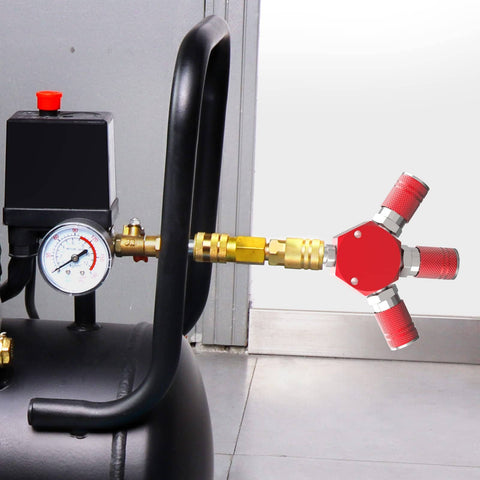 Red Aluminum 3 Way One Quarter Inch NPT Air Manifold With Hex Style Includes Three Steel Couplers Connected to Air Compressor