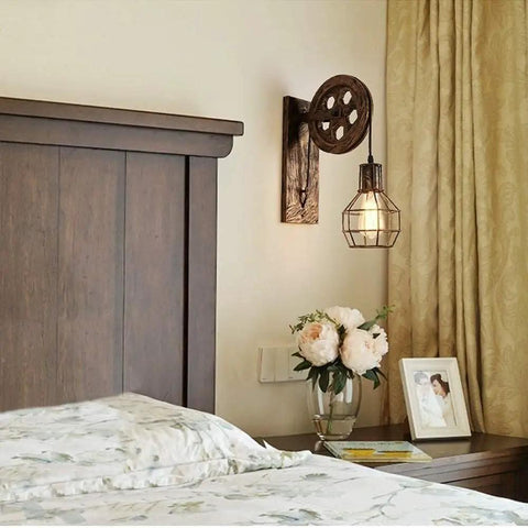 Set Of Two Retro Industrial Pulley Wall Lamps Crafted From Heavy Duty Vintage Metal With A Weathered Rustic Finish perfect for bedside lighting.