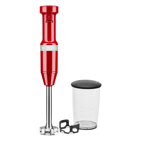 Premium Corded Hand Blender Engineered To Easily Whip Up Creamy Smoothies And Silky Soups Fast With Variable Speed Trigger And Removable Stainless Steel Blades In Deep Empire Red Finish alongside a 3-cup jar.