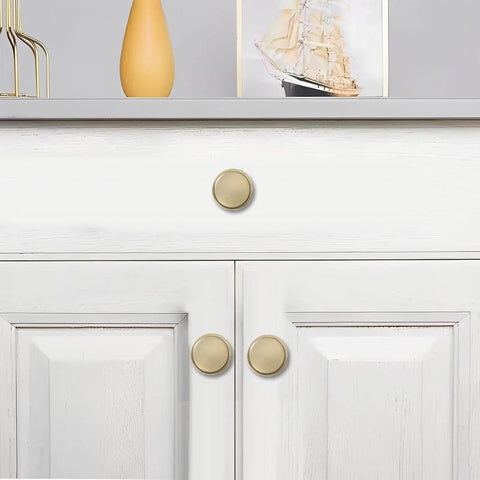 Rock Solid Heavy Duty Cabinet Knobs In Sleek Champagne Bronze Finish For Kitchens And Bathrooms 10 Pack on white drawers.