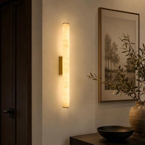 JCQASRT 19.69 in Modern Wall Sconce, 3-Color Changing LED Wall Light Fixture, illuminated brass and resin wall lamp in cozy interior.