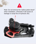 Hycline eBike hydraulic disc brake caliper set with red mounting adapter, front view