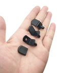 Hella Sturdy Cabinet Shelf Pins And Bracket Pegs With Rubber Sleeves For Adjustable Shelving Upgrades in hand, showcasing four black peg pieces.