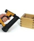 Nailer with wooden box, featuring Headless 23 Gauge Pin Nails 1 Inch 3000 Pack For Finish Nailing And DIY Projects, Durable Coated Finish.