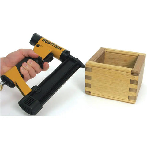 Nailer with wooden box, featuring Headless 23 Gauge Pin Nails 1 Inch 3000 Pack For Finish Nailing And DIY Projects, Durable Coated Finish.