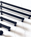 Matte Black Cabinet Pull Handle 2.75 Inch Centers 70 Mm Center to Center Drawer Knob Pull for Kitchen Cabinets Dresser Pulls Hardware Includes 1 Inch Screws Easy Mount DIY Friendly Durable Metal Finish, varying sizes shown on white background