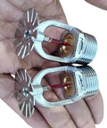 Quick Response Pendent Fire Sprinkler Head 155F Chrome Brass Half Inch Red Glass Bulb Parabolic Downward Spray Pattern held in hand