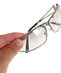Dope Metal Frame Retro Sunglasses For Women With Hollow Design held by hand, highlighting street style and UV400 protection.