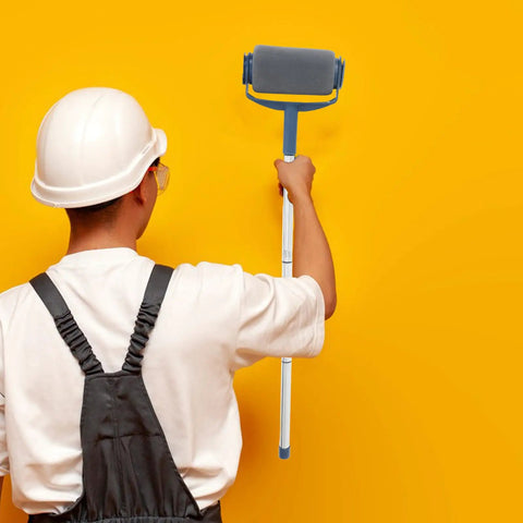 Person holding Extendable Paint Roller Kit With Adjustable Pole For Ceiling Painting Featuring Ergonomic Grip in front of yellow wall.