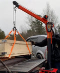 Foldable Truck Bed Crane With 3,500 Lb Electric Winch Kit loading a crate onto a pickup, 12V painted steel jib crane, 360 swivel lift in use.