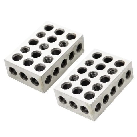 Two 1x2x3 inch hardened steel setup blocks with 23 threaded holes, angled view