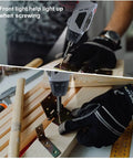 Mini Cordless Electric Screwdriver And Power Drill Set With 45 Precision Bits 4 8V Wireless Hand Tool Featuring Bright Led Light in use with wooden piece.