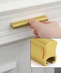 Six Pack Adjustable Matte Gold Drawer Pulls For Cabinets And Furniture shown in use on white drawer