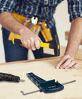 Person using the Universal Drawer Slide Jig Cabinet Hardware Installation Tool with hammer and drill for precise alignment.