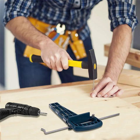 Person using the Universal Drawer Slide Jig Cabinet Hardware Installation Tool with hammer and drill for precise alignment.