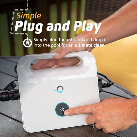Hands operating E10 Automatic Robotic Pool Vacuum Cleaner With Active Scrub Brush And Easy Top Load Filter Access on table