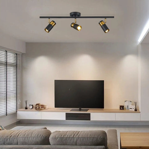 Living room with Three Light Black Track Lighting With Rotatable Heads GU10 Ceiling Spotlights For Living Room Hallway Studio Adjustable Indoor LED Spotlight Fixtures Now installed on the ceiling.