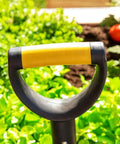 Compact 30 Inch Mini Shovel For Precision Digging with cushioned D-Grip handle in a garden setting