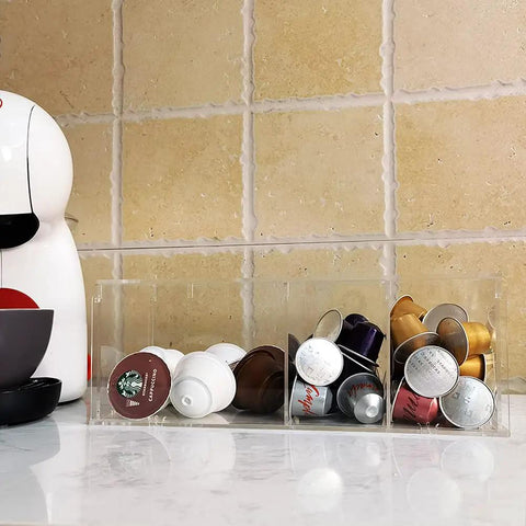 Clear Acrylic 4 Compartment Coffee Capsule Holder With Lid K Cup Organizer For Pods on kitchen counter with capsules sorted.