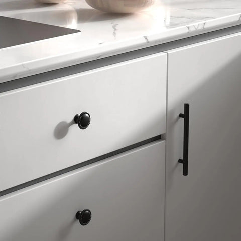 Matte Black Cabinet Knobs 20 Pack Dope Zinc Alloy Hardware on white cabinet drawers with sleek lace design.