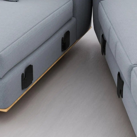 Close-up of Beefy 4 Piece Sectional Sofa Connector Brackets Black Iron Heavy Duty Couch Connecting Clamps on grey sectional