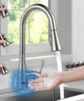 Touchless Kitchen Faucet With Sensor, Pull-Down Sprayer, Single Handle shown with water flow and hand activation in kitchen setting